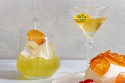Two glasses of mustard-infused cocktails