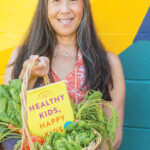 Dr. Elisa Song with her book Healthy Kids, Happy Kids